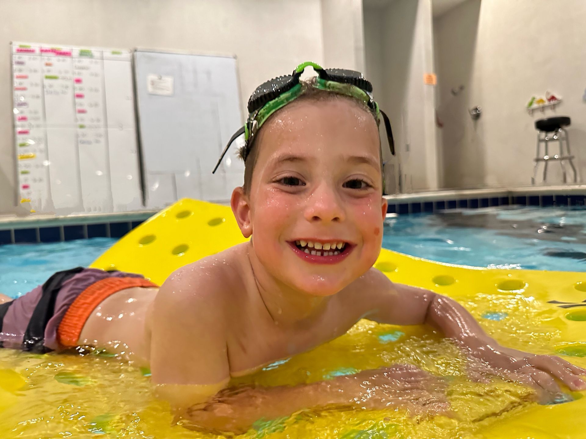 A child practicing during a one-to-one Swimming Simply lesson